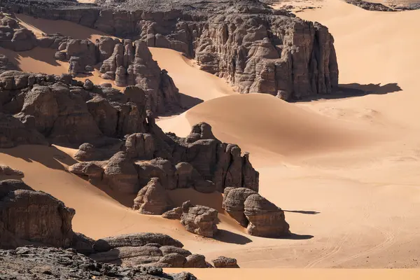 stock image view in the Sahara desert of Tadrart rouge tassili najer in Djanet City  ,Algeria.colorful orange sand, rocky mountains