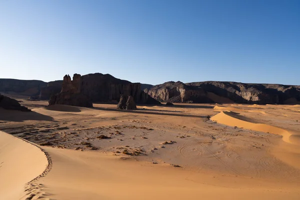 stock image view in the Sahara desert of Tadrart rouge tassili najer in Djanet City  ,Algeria.colorful orange sand, rocky mountains