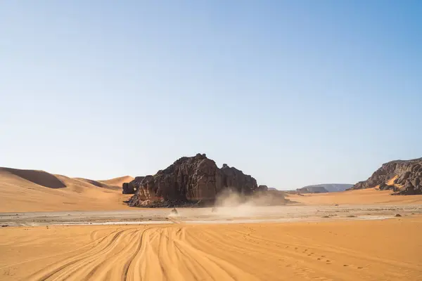 stock image view in the Sahara desert of Tadrart rouge tassili najer in Djanet City  ,Algeria.colorful orange sand, rocky mountains