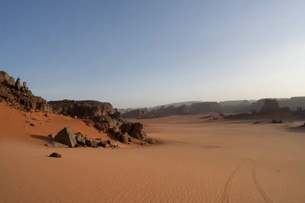 stock image view in the Sahara desert of Tadrart rouge tassili najer in Djanet City  ,Algeria.colorful orange sand, rocky mountains