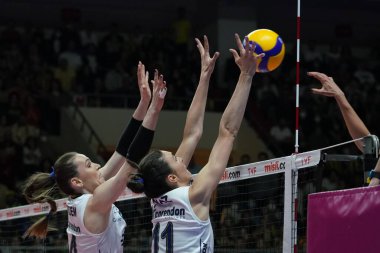 ISTANBUL, TURKEY - APRIL 30, 2022: Eda Erdem Dundar and Naz Aydemir Akyol in action during Fenerbahce Opet vs Vakifbank Turkish Sultans League Playoff Final match in Burhan Felek Sport Hall