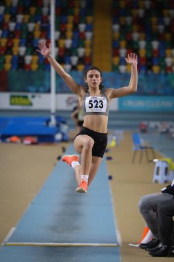 ISTANBUL, TURKEY - JANUARY 16, 2022: Undefined athlete long jumping during Turkish Athletic Federation Indoor Athletics Record Attempt Races