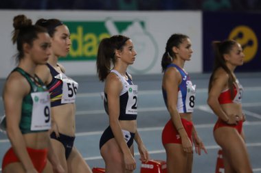 ISTANBUL, TURKEY - MARCH 05, 2022: Athletes running 60 metres during Balkan Athletics Indoor Championships in Atakoy Athletics Arena