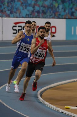 ISTANBUL, TURKEY - MARCH 05, 2022: Athletes running during Balkan Athletics Indoor Championships in Atakoy Athletics Arena