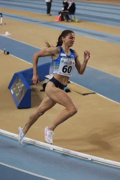 stock image ISTANBUL, TURKEY - MARCH 05, 2022: Lenuta Simiuc Petronela running during Balkan Athletics Indoor Championships in Atakoy Athletics Arena