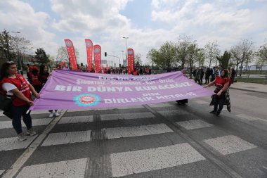 ISTANBUL, TURKEY - MAY 01, 2022: People march in International Workers Day