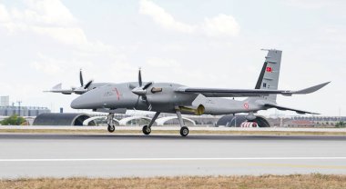 KONYA, TURKIYE - JUNE 30, 2022: Baykar Technologies Bayraktar Akinci UCAV Tiha (PT-5) landing to Konya Airport during Anatolian Eagle Air Force Exercise