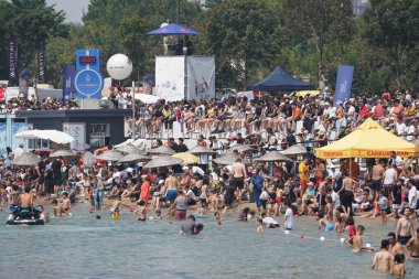 ISTANBUL, TURKIYE - AUGUST 14, 2022: Spectators watching performances in Red Bull Flugtag, competitors flight with hand made human powered flying machines