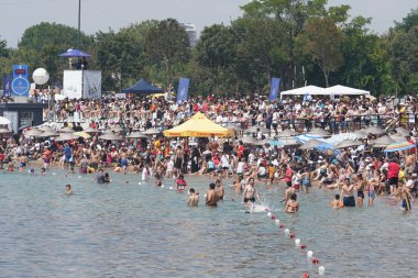 ISTANBUL, TURKIYE - AUGUST 14, 2022: Spectators watching performances in Red Bull Flugtag, competitors flight with hand made human powered flying machines