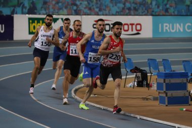 ISTANBUL, TURKEY - MARCH 05, 2022: Athletes running during Balkan Athletics Indoor Championships in Atakoy Athletics Arena
