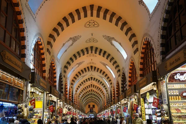 ISTANBUL, TURKIYE - FEBRUARY 11, 2023: People shopping at Spice Bazaar. The Spice Bazaar is one of the oldest bazaar in Istanbul.