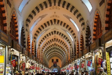 ISTANBUL, TURKIYE - FEBRUARY 11, 2023: People shopping at Spice Bazaar. The Spice Bazaar is one of the oldest bazaar in Istanbul.