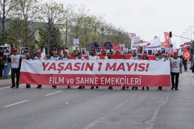 ISTANBUL, TURKEY - MAY 01, 2022: People march in International Workers Day