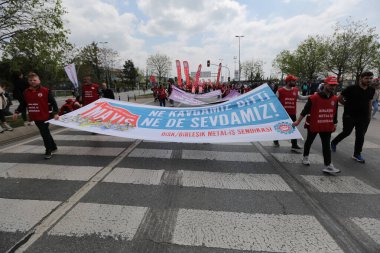 ISTANBUL, TURKEY - MAY 01, 2022: People march in International Workers Day