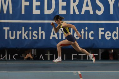 ISTANBUL, TURKEY - FEBRUARY 26, 2022: Undefined athlete running during Turkish Indoor Athletics Championships in Atakoy Athletics Arena