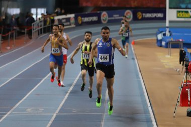 ISTANBUL, TURKEY - FEBRUARY 26, 2022: Athletes running during Turkish Indoor Athletics Championships in Atakoy Athletics Arena