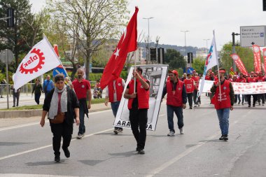 ISTANBUL, TURKEY - MAY 01, 2022: People march in International Workers Day