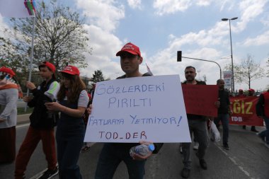ISTANBUL, TURKEY - MAY 01, 2022: People march in International Workers Day