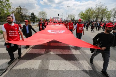 ISTANBUL, TURKEY - MAY 01, 2022: People march in International Workers Day