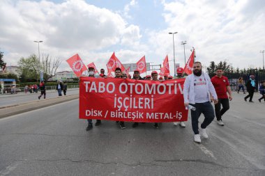 ISTANBUL, TURKEY - MAY 01, 2022: People march in International Workers Day