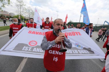 ISTANBUL, TURKEY - MAY 01, 2022: People march in International Workers Day