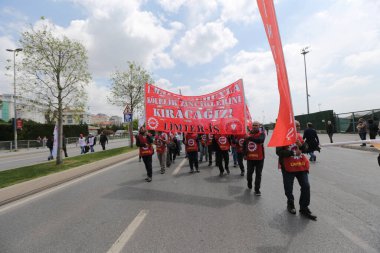 ISTANBUL, TURKEY - MAY 01, 2022: People march in International Workers Day