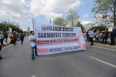 ISTANBUL, TURKEY - MAY 01, 2022: People march in International Workers Day