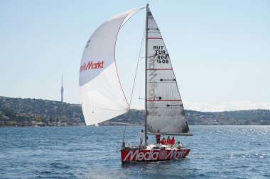 ISTANBUL, TURKIYE - SEPTEMBER 24, 2022: Sailboat competing in Bosphorus Cup
