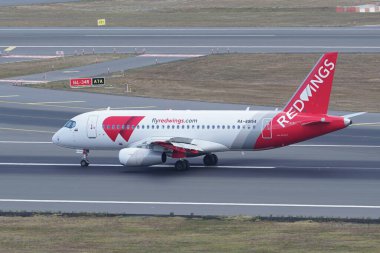 ISTANBUL, TURKIYE - AUGUST 06, 2022: Red Wings Airlines Sukhoi SuperJet 100-95B (95122) landing to Istanbul International Airport