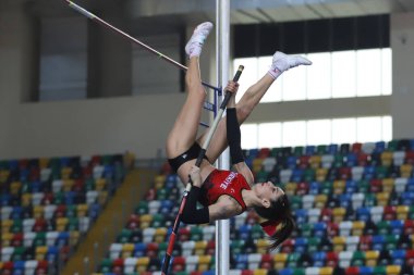 ISTANBUL, TURKEY - MARCH 05, 2022: Undefined athlete pole vaulting during Balkan Athletics Indoor Championships in Atakoy Athletics Arena