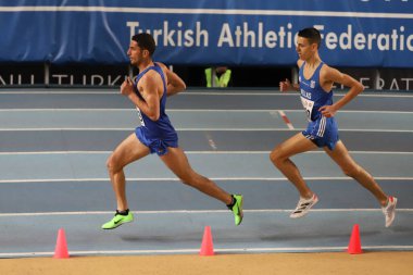 ISTANBUL, TURKEY - MARCH 05, 2022: Athletes running during Balkan Athletics Indoor Championships in Atakoy Athletics Arena