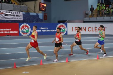 ISTANBUL, TURKEY - MARCH 05, 2022: Athletes running during Balkan Athletics Indoor Championships in Atakoy Athletics Arena
