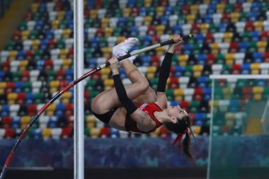 ISTANBUL, TURKEY - MARCH 05, 2022: Undefined athlete pole vaulting during Balkan Athletics Indoor Championships in Atakoy Athletics Arena