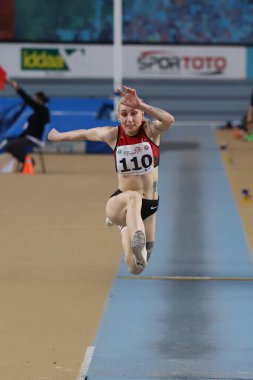 ISTANBUL, TURKEY - MARCH 05, 2022: Tugba Danismaz triple jumping during Balkan Athletics Indoor Championships in Atakoy Athletics Arena