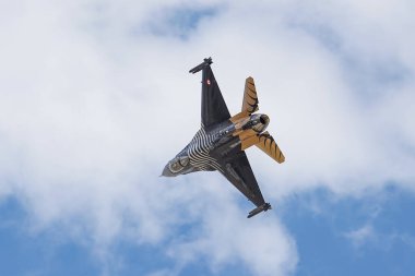 KONYA, TURKIYE - JUNE 30, 2022: Turkish Air Force General Dynamics F-16C Fighting Falcon SoloTurk (4R-23) aerobatic demonstrate over Konya Airport during Anatolian Eagle Air Force Exercise