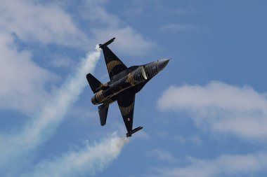 KONYA, TURKIYE - JUNE 30, 2022: Turkish Air Force General Dynamics F-16C Fighting Falcon SoloTurk (4R-23) aerobatic demonstrate over Konya Airport during Anatolian Eagle Air Force Exercise