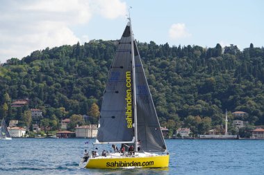 ISTANBUL, TURKIYE - SEPTEMBER 24, 2022: Sailboat competing in Bosphorus Cup