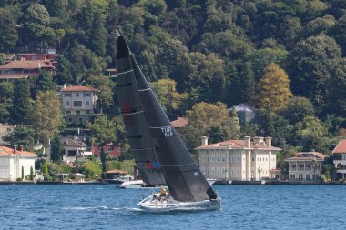 ISTANBUL, TURKIYE - SEPTEMBER 24, 2022: Sailboat competing in Bosphorus Cup