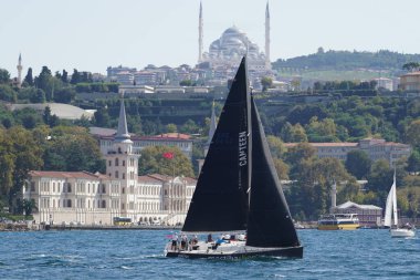 ISTANBUL, TURKIYE - SEPTEMBER 24, 2022: Sailboat competing in Bosphorus Cup