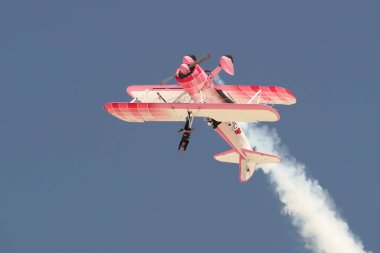 ESKISEHIR, TURKIYE - SEPTEMBER 18, 2022: Boeing PT-13D Kaydet (75-5099) Wing walking show display in Sivrihisar SHG Airshow