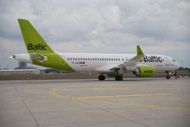 ISTANBUL, TURKIYE - OCTOBER 08, 2022: Air Baltic Airbus A220-371 (55165) display in Istanbul Airshow in Istanbul Ataturk Airport