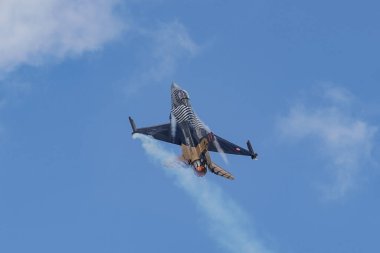 KONYA, TURKIYE - JUNE 30, 2022: Turkish Air Force General Dynamics F-16C Fighting Falcon SoloTurk (4R-23) aerobatic demonstrate over Konya Airport during Anatolian Eagle Air Force Exercise