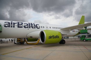 ISTANBUL, TURKIYE - OCTOBER 08, 2022: Air Baltic Airbus A220-371 (55165) display in Istanbul Airshow in Istanbul Ataturk Airport