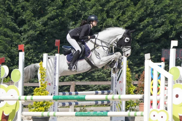 stock image BURSA, TURKIYE - APRIL 08, 2023: Unidentified rider jumps with horse during the Turkish Equestrian Federation race