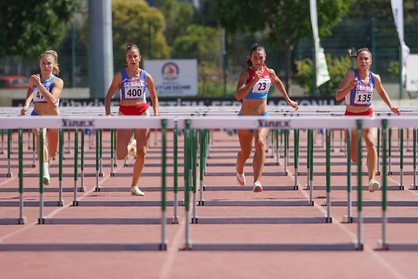 stock image DENIZLI, TURKIYE - JULY 17, 2022: Athletes running 100 metres hurdles during Balkan Athletics U20 Championships in Denizli Albayrak Athletics Track