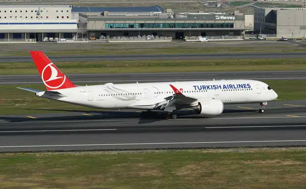 stock image ISTANBUL, TURKIYE - OCTOBER 01, 2022: Turkish Airlines Airbus A350-941 (454) landing to Istanbul International Airport