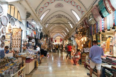 ISTANBUL, TURKIYE - JULY 13, 2023: People shopping in the Grand Bazaar. The Grand Bazaar is one of the largest and oldest covered markets in the world. clipart