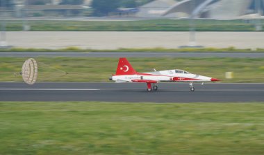 ISTANBUL, TURKIYE - MAY 01, 2023: Turkish Stars, Turkish Air Force aerobatic demonstration team display in Istanbul Ataturk Airport during Teknofest Istanbul clipart