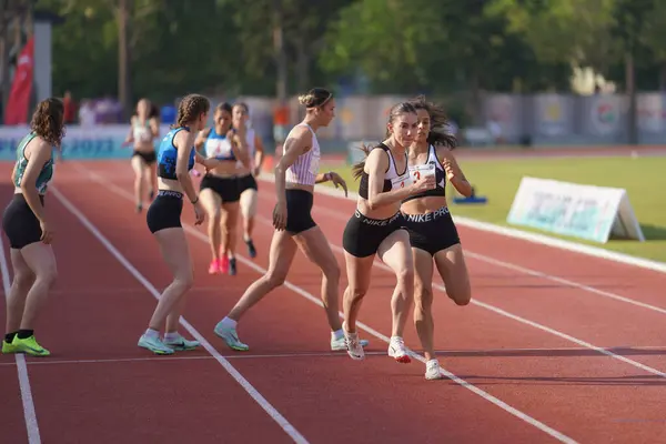 stock image IZMIR, TURKIYE - JULY 05, 2023: Athletes running 4x400 metres relay during Super League Competitions in Izmir Seha Aksoy Athletics Field