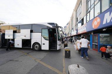 ISTANBUL, TURKIYE - APRIL 06, 2024: People in Esenler Coach Terminal in Istanbul. Terminal is the central and largest bus terminus for intercity bus service in Istanbul clipart